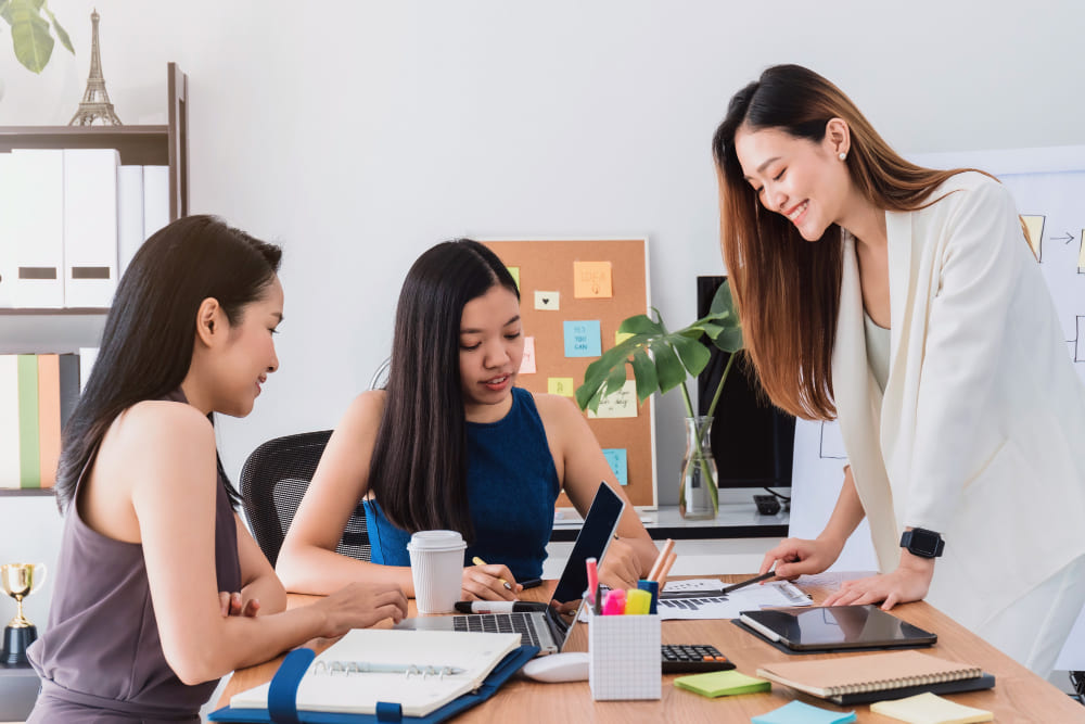 Group of beautiful women meeting in office to discussion or brainstorm business startup project..