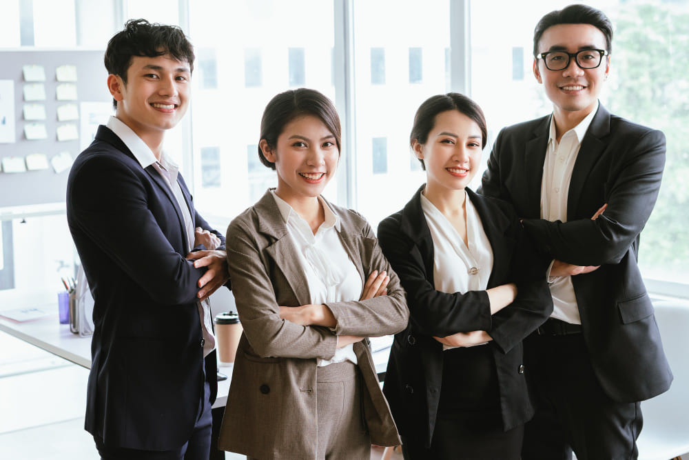 A group of RPO service male female consultants in suits at Manpower Vietnam