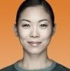 A face portrait of a woman smiling against an orange background | Contract Recruitment