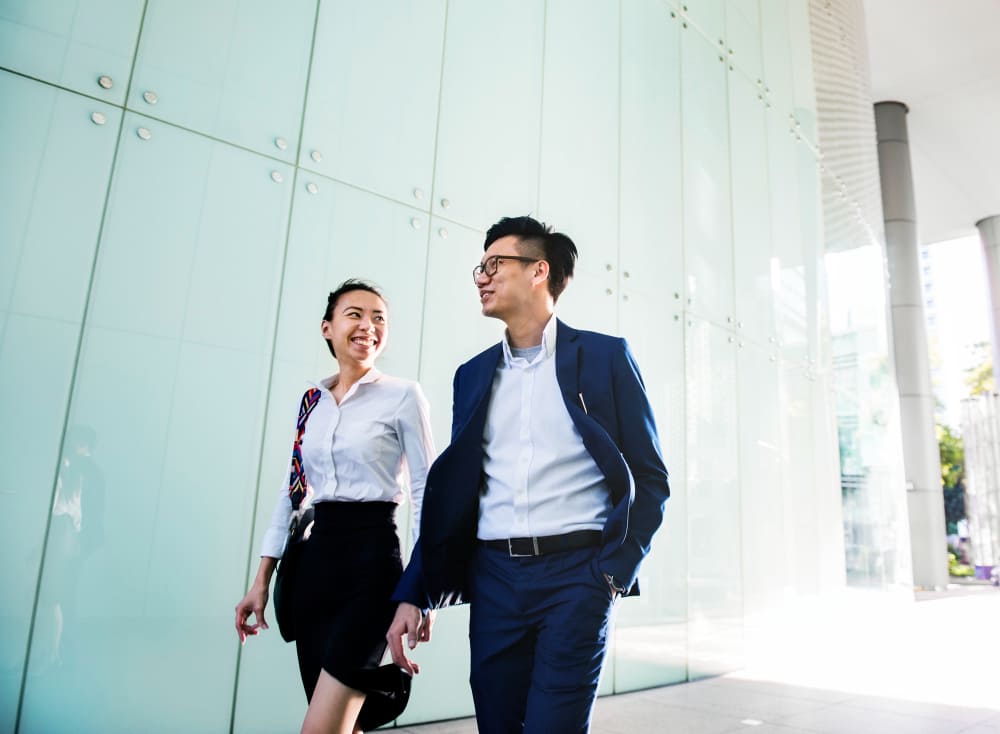 A Female consultant for the RPO service in Vietnam walking with a client